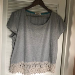 Grey crop top with pattern at bottom